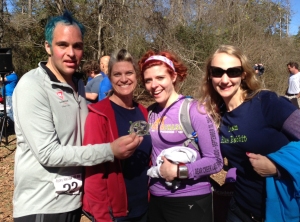Me, Heather, Jenn and Jessica right after the race with the buckle that belongs to us all